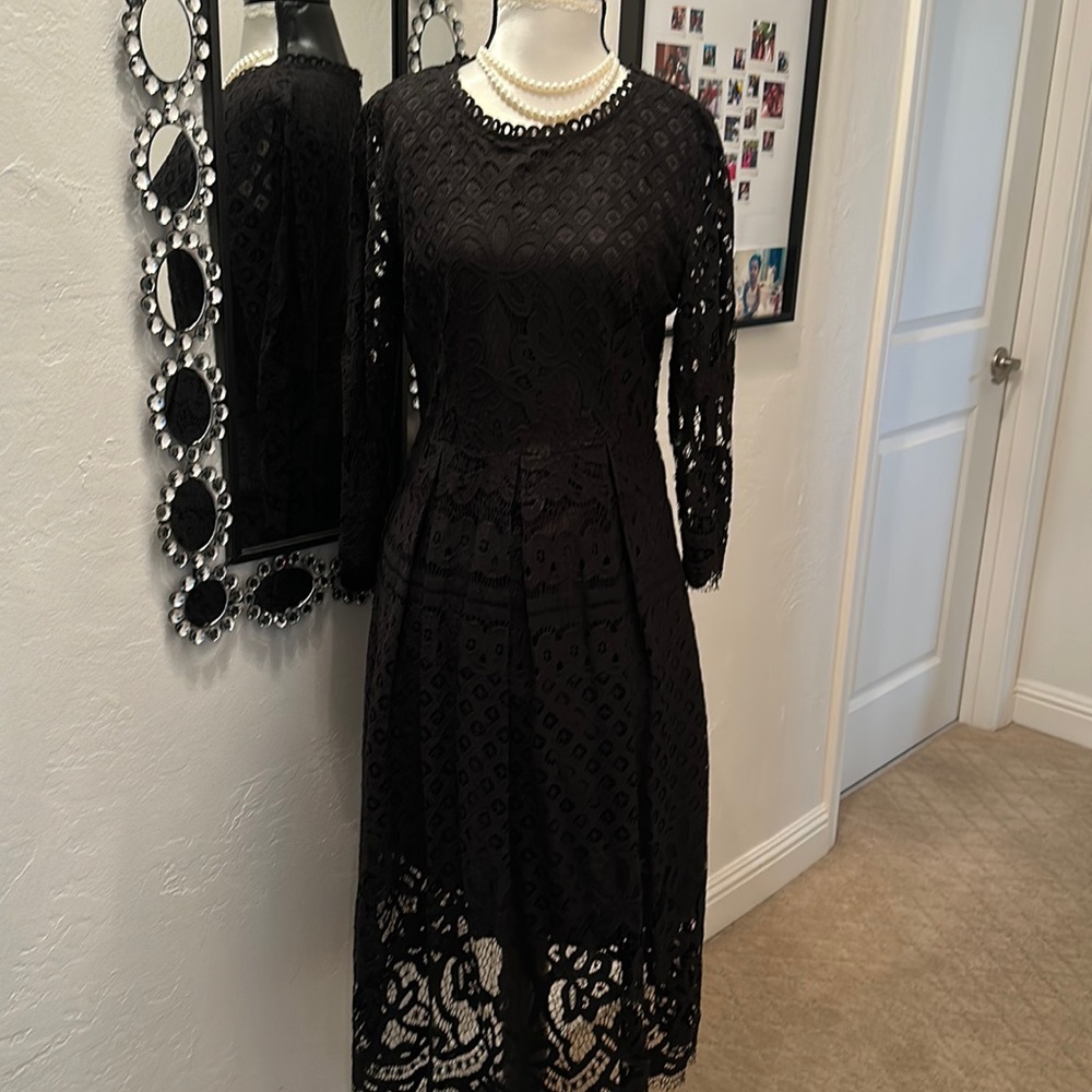 Black lace dress with three-quarter length sleeves